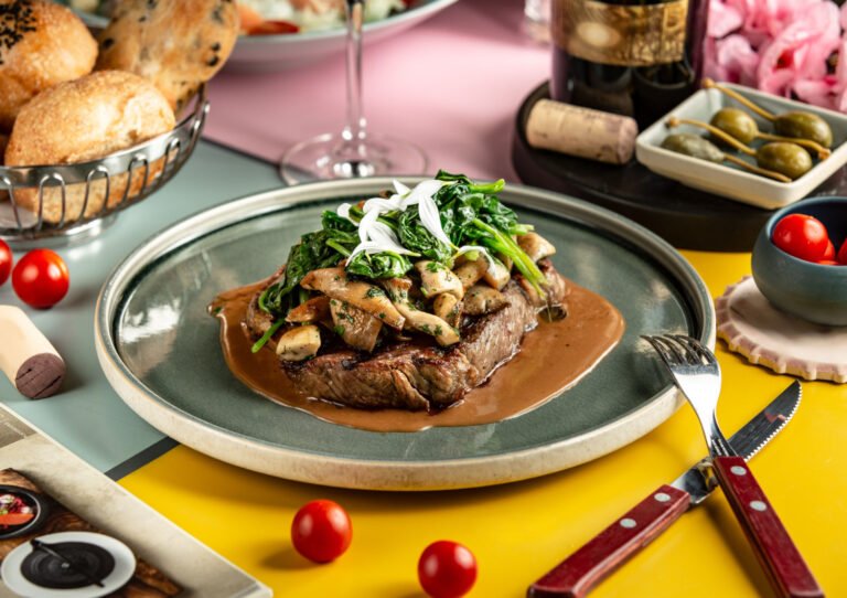 lamb steak topped with sauteed mushroom spinach